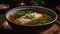 A steaming bowl of fragrant fish soup