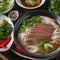 A steaming bowl of pho with thin-sliced beef and fresh herbs4