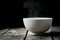 Steaming bowl on rustic wood background