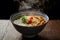 Steaming bowl of udon, Japanese comfort captured in photograph