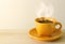 Steaming coffee cup on table