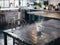 Steaming coffee on rustic table in a cozy, sunlit kitchen