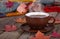 Steaming Cup of Coffee With Autumn Decor