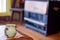 Steaming cup of coffee in bird mug with a vintage propane / natural gas cabin heater in the background - taken at a rustic cabin i