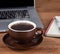 Steaming Cup of Coffee on a Desktop