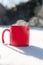 Steaming cup of hot coffee,tea or chocolatemilk in the cold fresh white snow, Winter,cozy,drink,snowy day concept