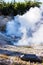 Steaming geothermic pool at Yellowstone National Park