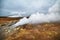 Steaming geysers in a beautifil Iceland landscape.