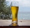 A steaming glass of beer stands on the bar