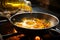 A steaming hot pan receives a stream of food oil for deep frying