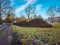 Steaming pile of manure on farm field in the winter