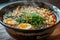 Steaming ramen bowl with egg and greens