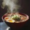 steaming ramen with two egg pieces and scallions in a bowl