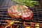 steaming steak on grill taken from high angle