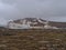 Steaming Svartsengi geothermal power station near Grindavik, Reykjanes, Iceland with moss covered lava field in front in winter.