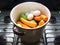 Steaming vegetables with egg, carrot, potato and chayote, vegetable concept