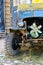 Steampunk bizarre auto with open engine. Creepy truck with rusted parts