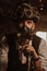 Steampunk cosplay. Portrait of a man in a top hat, glasses and a gas mask