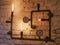 Steampunk decor. With iron pipes. and incandescent lamps. Loft style wall and steampunk pipes