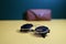 steampunk sunglasses with leather case on dark background