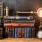 A steampunk-themed study with exposed gears, leather-bound books, and antique brass accents2, Generative AI