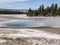 Steamy blue geyser at Yellowstone National Park