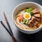 A steamy bowl of ramen with perfectly cooked noodles, slices of tender pork, and a soft-boiled egg