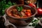 Steamy bowl of traditional Hungarian goulash with tender beef, paprika, and savory spices, garnished with a sprig of fresh parsley