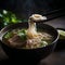 Steamy Close-Up of Vietnamese Pho Noodle Soup with Beef or Chicken