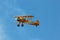 Stearman Biplane Flying Through Blue Skies