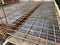 Steel bar rebar metal framework reinforcement for concrete at construction site.