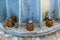 Steel bolts and rusty steel nut on gray steel plate of lamp post. Structural Detail of a lighting post base