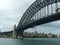 Steel bridge and ferry before shore with residential houses