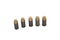 Steel cased, copper jecketed handgun bullets on a white background
