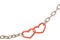 Steel chain with two joined red hearts on white background. 3D i