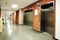 Steel door elevators in deserted hallway