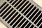 A steel drainage grate creates an interesting pattern.