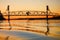 Steel Draw Bridge over a River at Sunset