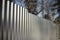 Steel fence with barbed wire. Fencing of territory. Industrial zone. Stainless steel