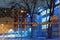 Steel fence with a basketball court at night in the background in New York City`s Harlem neighborhood