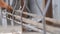 Steel fixers connecting steel rods for concrete reinforcement