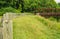 A Steel Footbridge and Wooden Guardrails on a Local Greenway