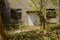 Steel gate of deserted 1970s` workshop in sunny spring