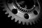 Steel gear wheels tools in dark background