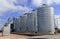 Steel grain silo on farm in rural setting