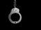 Steel handcuffs of police special equipment, fetters on a black background