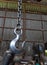 Steel hook for engine lift in garage.