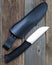 Steel hunting knife near the leather sheath