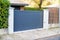 Steel large gray metal gate fence on modern house street