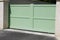 Steel large green clear metal gate fence on modern house street